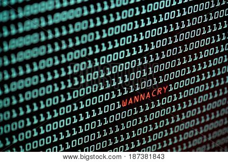 Ransomware or Wannacry text and binary code concept from the desktop screen. concept background, selective focus