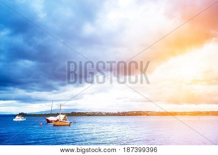 Blue Ocean With Boats And Coastline
