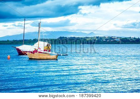 Blue Ocean With Boats And Coastline