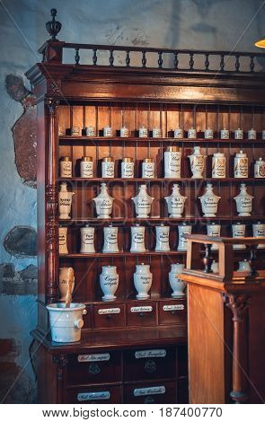 Kaunas, Lithuania - May 12, 2017: Old Apothecary Cabinet With Retro Vials, Porcelain Jars Of Drugs I
