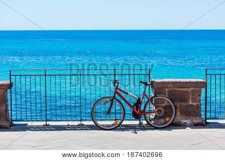 Old mountain bike by the sea in Alghero Italy