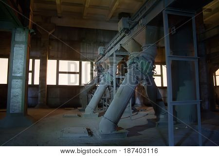 Old abandoned silo elevator with rusty equipment left