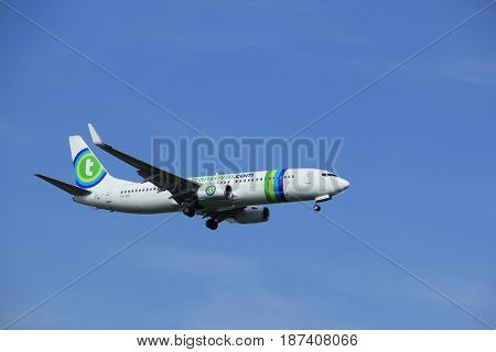 Amsterdam the Netherlands - July 21st 2016: PH-HSF Transavia Boeing 737 approaching Polderbaan runway at Schiphol Amsterdam Airport arriving from Girona Spain