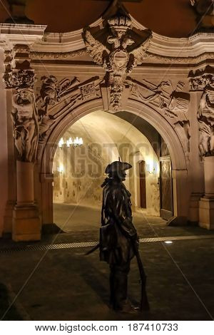 ALBA IULIA Romania - APRIL 29 2017: Night scene with bronze statue of one soldier in front of one Gate of the City in Citadel of Alba Iulia city.