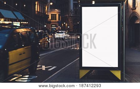 Blank advertising light box on the bus stop mockup of empty ad billboard on bus station template banner on background city street for message or text in Barcelona afisha board
