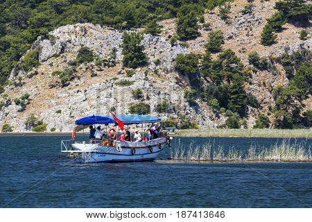 TURKEY, MUGLA ,DALYAN, - 5 MAY , 2017: The Dalyan River with tourist boats in the straits of the river