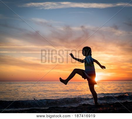 Happy boy enjoying the beach