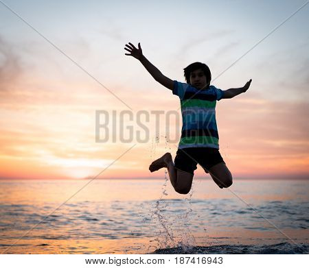 Happy boy enjoying the beach