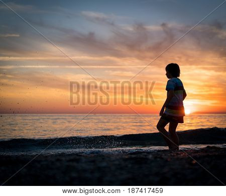 Happy boy enjoying the beach