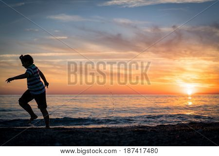 Happy boy enjoying the beach