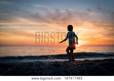 Happy boy enjoying the beach