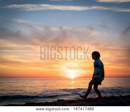 Happy boy enjoying the beach