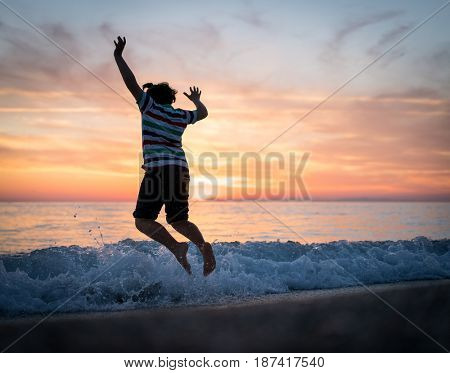 Happy boy enjoying the beach