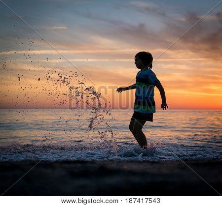Happy boy enjoying the beach