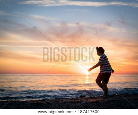 Happy boy enjoying the beach