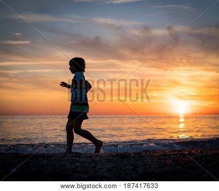 Happy boy enjoying the beach