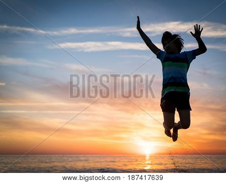Happy boy enjoying the beach