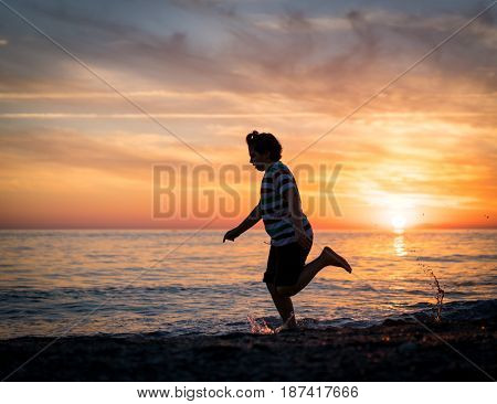 Happy boy enjoying the beach
