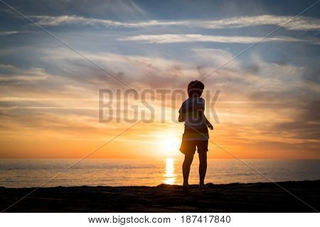 Happy boy enjoying the beach