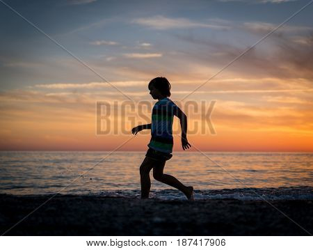 Happy boy enjoying the beach