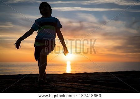 Happy boy enjoying the beach