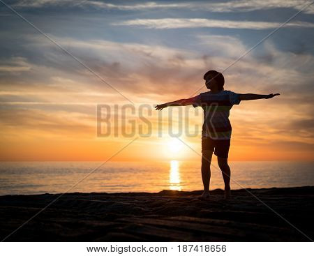 Happy boy enjoying the beach