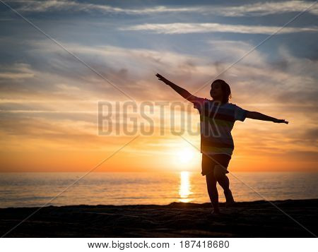 Happy boy enjoying the beach
