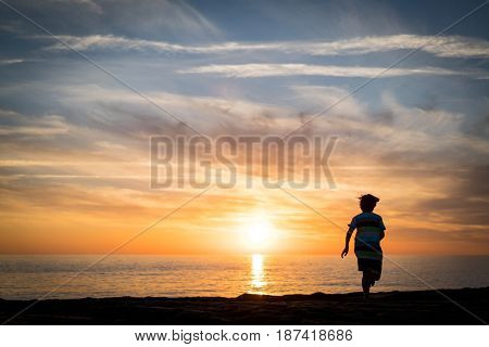 Happy boy enjoying the beach