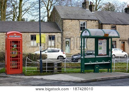 WADDINGTON, UK - FEBRUARY 4, 2017: A emergency defibrillator being used in a old style UK red phone box in the small village of Waddington, Lancashire, UK