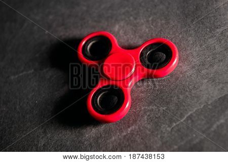Red spinner Fidget finger stress anxiety relief toy.