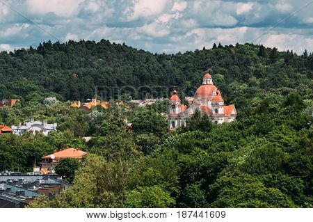 Vilnius, Lithuania. Aerial View Of Church Of Saints Peter And Paul At Sunny Summer Day. View Of Old Town Under Dramatic Sky. Vilnius Old Town Is Part Of UNESCO World Heritage. Antakalnio Street