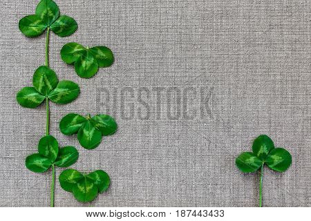 Green Leaves Of Clover On The Background Of Linen Cloth.