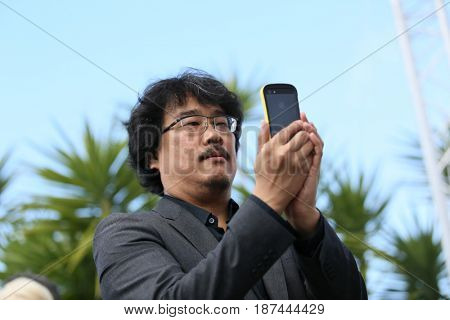Bong Joon-Ho attends the 'Okja' photocall during the 70th annual Cannes Film Festival at Palais des Festivals on May 19, 2017 in Cannes, France. 