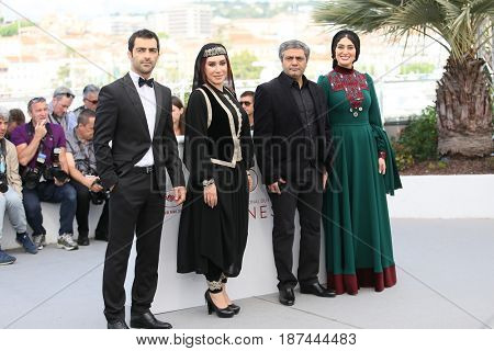 Soudabeh Beizaee, Mohammad Akhlaghirad and Nasim Adabi attend 'Lerd (Un Homme Integre)' Photocall during the 70th Cannes Film Festival at Palais des Festivals on May 19, 2017 in Cannes, France.