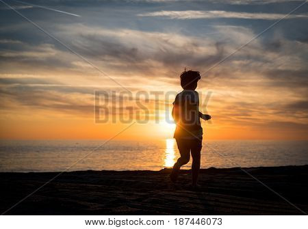 Happy boy enjoying the beach