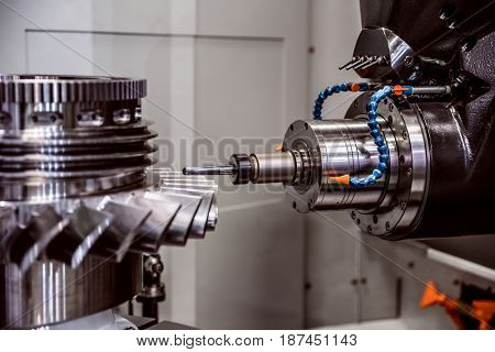 Metalworking CNC milling machine. Cutting metal modern processing technology. Small depth of field. Warning - authentic shooting in challenging conditions. A little bit grain and maybe blurred.
