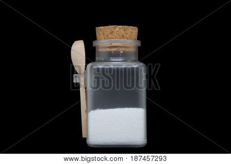 Bottled Sugar isolate on black background, Transparent Bottle with wooden spoon