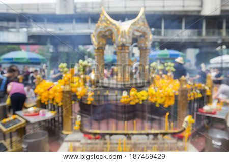 blurred background of Erawan shrine in Ratchaprasong Junction in Bangkok Thailand. Erawan shrine is famous place in Ratchaprasong area