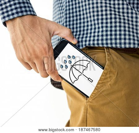 Hand holding digital device network graphic overlay from trouser pocket