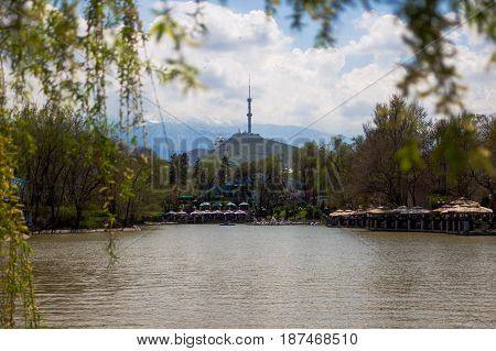 Central City Park, Almaty, Kazakhstan. View Of The Lake And Kok Tobe Hill