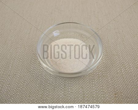 Prebiotic ingredient inulin powder in glass bowl
