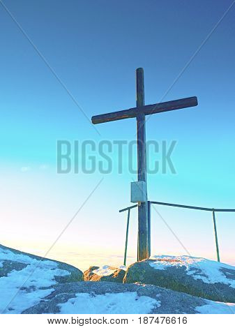 Sharp Summit  With Modest Cross Raised  On Mountain Peak.