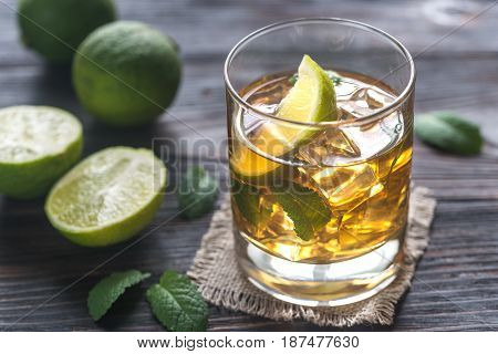 Glass Of Rum On The Wooden Background