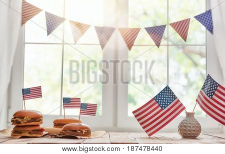 Patriotic holiday. USA are celebrate 4th of July. Top view with American flag on the table.