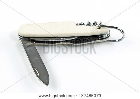A side view of a white open pocket knife isolated on a bright background.