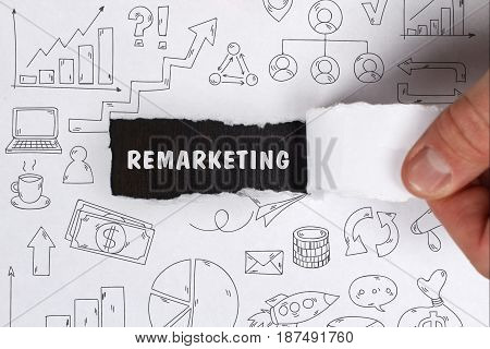 Business, Technology, Internet And Network Concept. Young Businessman Shows The Word: Remarketing