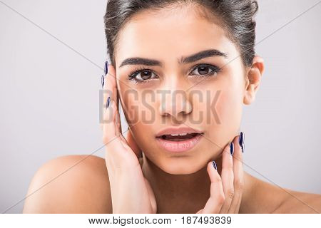 Beauty Woman Face Portrait Close Up. Beautiful Model Girl With Perfect Fresh Clean Skin On Grey