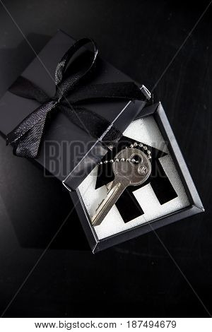 Black gift box with apartment keys - own housing