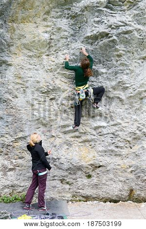 Person Climbing On The Rock At Engelberg