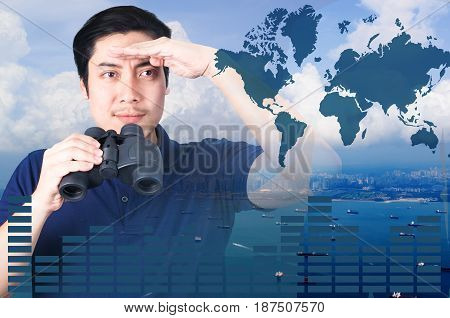 Double exposure of Asian investor with binoculars. Over seascape view from aerial and financial graph on blurred building background import export concept Elements of this image furnished by NASA.